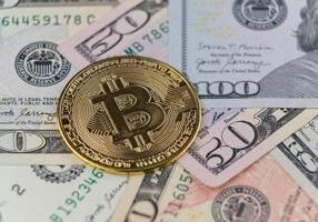 Pritzker signs cryptocurrency bills, sparking debate over protection, innovation